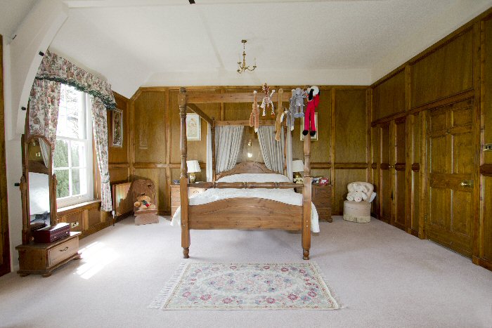 wood panelled bedroom